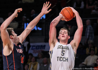 Yellow Jackets C Miller shoots over Virginia C Mike Tobey