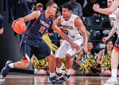 Yellow Jackets G Bolden gets in front of Cavaliers G Brogdon 