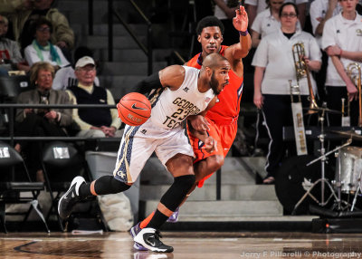 Yellow Jackets G Trae Golden drives along the baseline against Tigers G Harrison