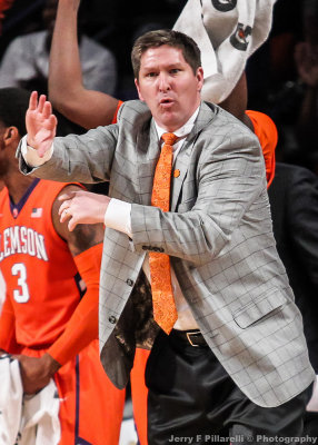 Clemson Tigers Head Coach Brad Brownell signals to his team from the bench