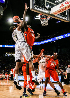 Georgia Tech F Georges-Hunt shoots over a leaping Clemson C Nnoko