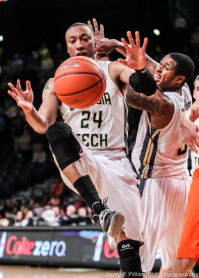 Yellow Jackets F Holsey tries to corral a loose ball
