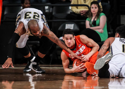 Jackets G Golden tries to take a loose ball from Hokies G Wilson