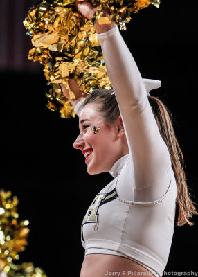 Georgia Tech Cheerleader works the crowd during a break in the action