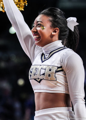 Georgia Tech Cheerleader performs during a break in the action