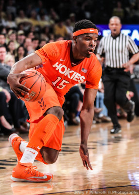 Hokies G Ben Emelogu changes direction at the three point line