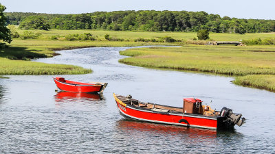 Two boats moored in an inland sound on Cape Cod