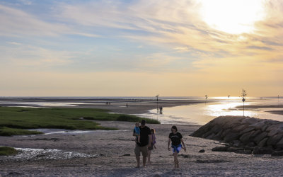 A family on the beach at Rock Harbor on Cape Cod