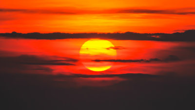 The sun, shrouded by early morning clouds, from Cadillac Mountain in Acadia National Park