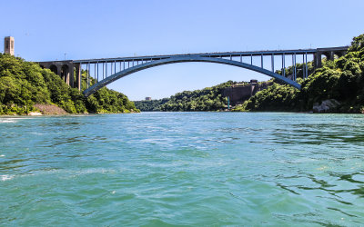 Rainbow Bridge from water level joins the US to Canada at Niagara Falls