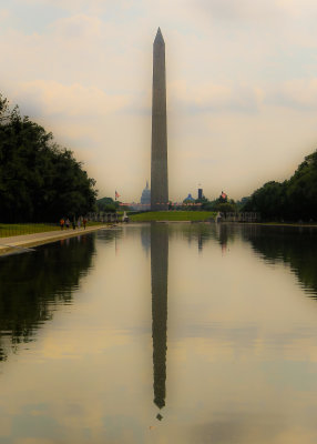 The Washington Monument and the Capitol Building mirrored in the Reflecting Pool in Washington DC
