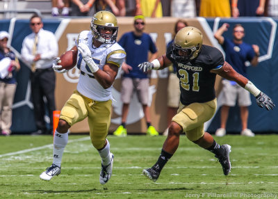 Tech WR DeAndre Smelter is chased after a catch by Terriers LB Travis Thomas