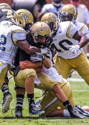 Yellow Jackets stop Terriers RB Colvin after a short gain