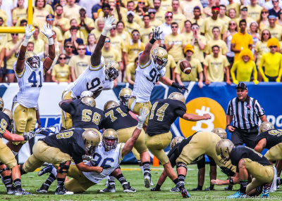 Yellow Jackets D-Line attempts to block a Terriers field goal