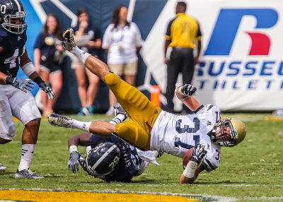 Yellow Jackets B-back Laskey is upended after a gain