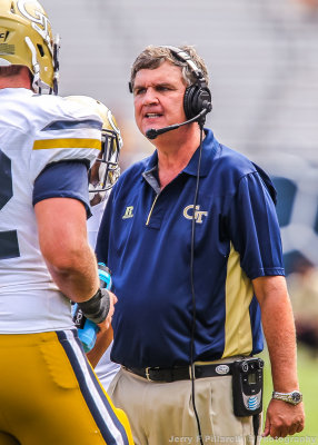 Georgia Tech Head Coach Paul Johnson makes a point to one of his players