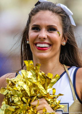 Yellow Jackets Cheerleader works the crowd in the last minute of the game