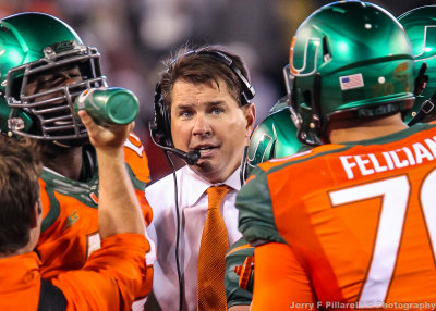 Miami Hurricanes Head Coach Al Golden talks to his players during a timeout