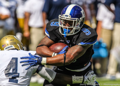 Blue Devils RB Josh Snead moves past Jackets DB Jamal Golden