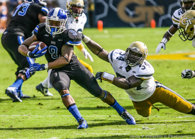 Duke RB Snead escapes the arm tackle of Tech LB Quayshawn Nealy