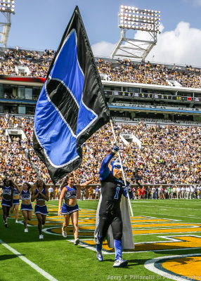 Duke parades their flag in the end zone after a score