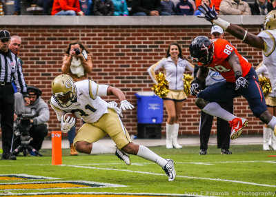 Jackets A-back Hill dives into the end zone for the first score of the day