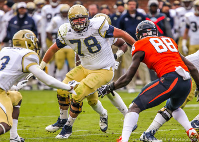Jackets OL Trey Braun sets up for a block of Cavaliers OLB Max Valles