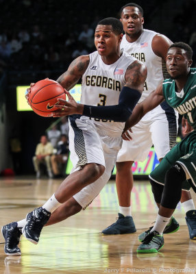 Georgia Tech F Georges-Hunt drives around Charlotte G Ogbueze