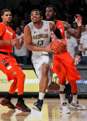 Yellow Jackets F Sampson drives the baseline on Syracuse defenders