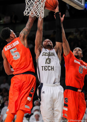 Jackets F Sampson goes up against Orange F Chris McCullough and G Michael Gbinije