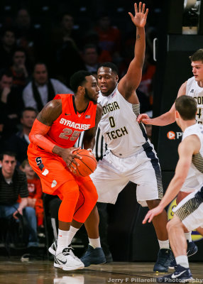 Georgia Tech F Mitchell squares up on Syracuse F Christmas