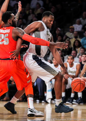 Yellow Jackets F Mitchell dribbles around Orange F Christmas