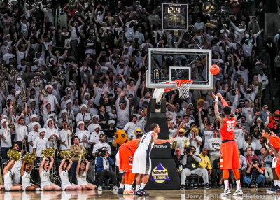 Syracuse F Rakeem Christmas puts up the winning free throw as the fans try to distract him