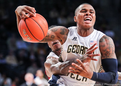 Jackets F Georges-Hunt is fouled by a Wolfpack defender on his way to the basket