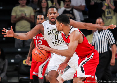 Georgia Tech F Mitchell gets in front of a NC State ball handler