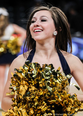 Jackets Dance Team Member in action during a timeout