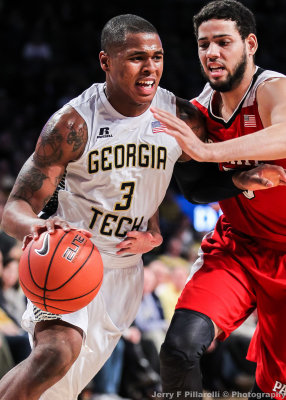 Georgia Tech F Georges-Hunt drives by NC State F Martin