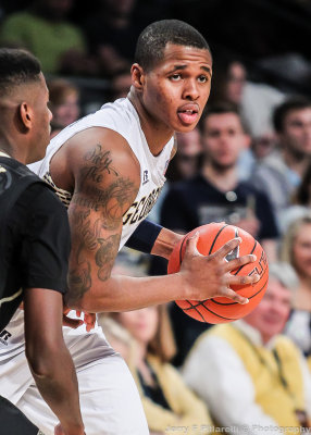 Yellow Jackets F Georges-Hunt looks to pass around a Deacons defender