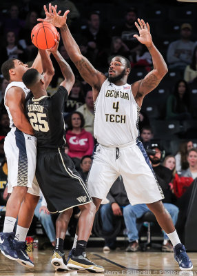 Jackets C Cox looks to disrupt a pass by Demon Deacons F Cornelius Hudson