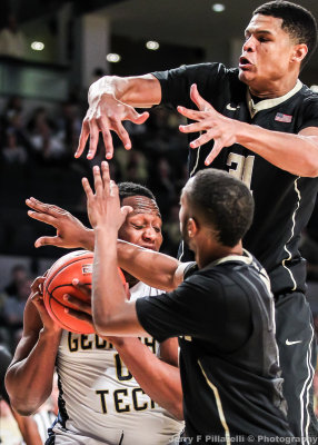 Georgia Tech F Mitchell is surrounded by Wake Forest defenders