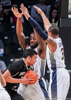 Jackets C Cox stays in front of a Demon Deacons ball handler