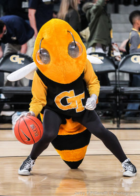 Jackets Mascot Buzz shows off his B-Ball skills during halftime festivities