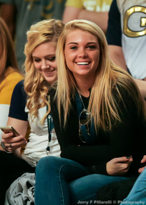 Georgia Tech Fan watching the game from courtside seats