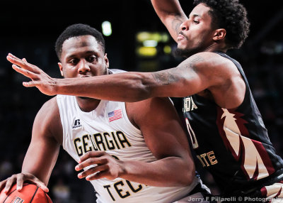 Jackets F Mitchell tries to get around Seminoles F Cofer