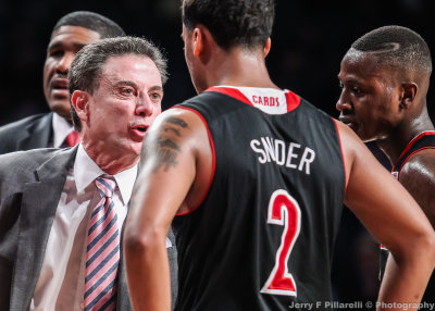 Louisville Cardinals Head Coach Rick Pitino has a discussion with G Quentin Snider
