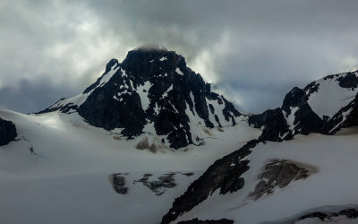 The sun struggles to break through the clouds near Shamrock Glacier