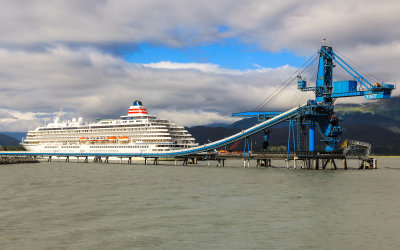 Cruise ship and coal transport tower in the port town of Seward