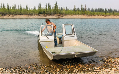 Bettles Lodge owner Eric fires up the boat to go to Old Bettles on the Koyakuk River