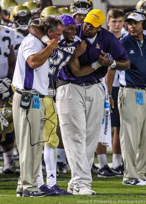 Alcorn St. Braves Head Coach Jay Hopson helps an injured player off the field
