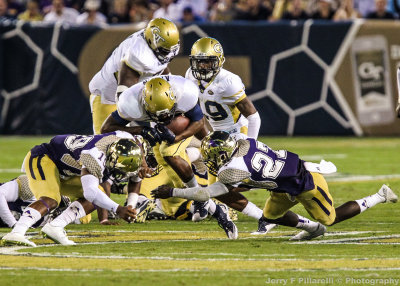 Georgia Tech B-Back Marcus Allen braces for a collision with two Alcorn St. defenders